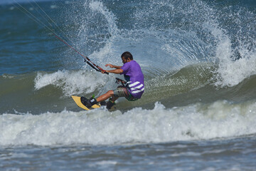 Fototapeta premium Kite surfer riding a kiteboard