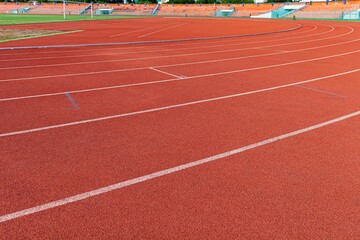 The curved lane in running track or athlete track in stadium. Running track is a rubberized artificial running surface for track and field athletics