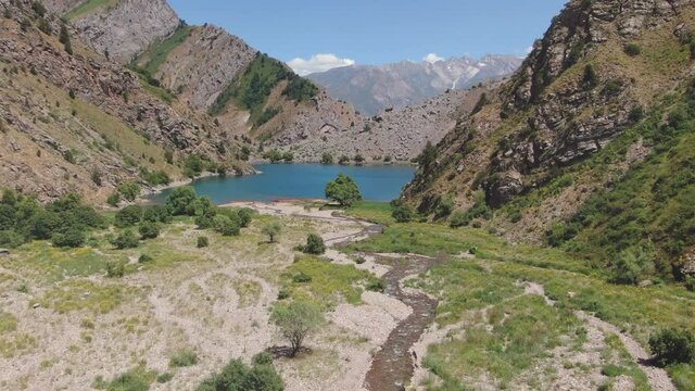 Flying Towards Misty Urungach Lake Of Ugam-​Chatkal National Park In Tashkent Region, Uzbekistan. - Aerial Shot