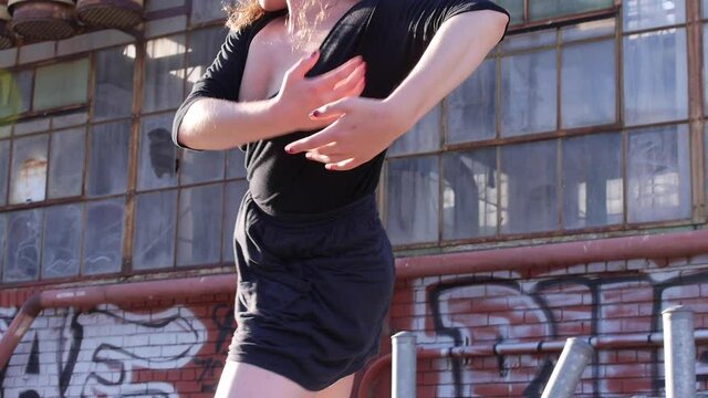 Dancer Flows Interpretative, Close Up, Abandoned Industrial Brick Building, Broken Windows