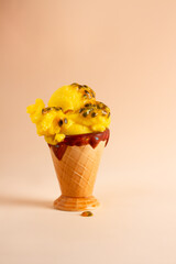 passion fruit ice cream, yellow ice cream, brown background