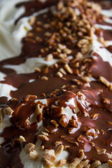 soft vanilla ice cream with chocolate and peanuts