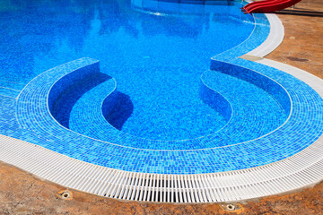 Swimming pool with clear water at a tropical resort