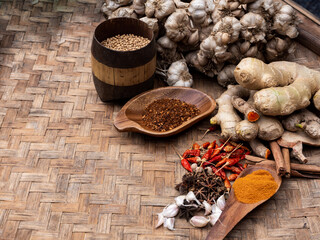 Top view of colourful spices in wooden tray. Asian popular cooking ingredients, dry hot healthy cook herbs. view form above and copy space background.