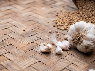 Garlics in wooden tray. Asian popular cooking ingredients, dry hot healthy cook herbs. view form above and copy space background.