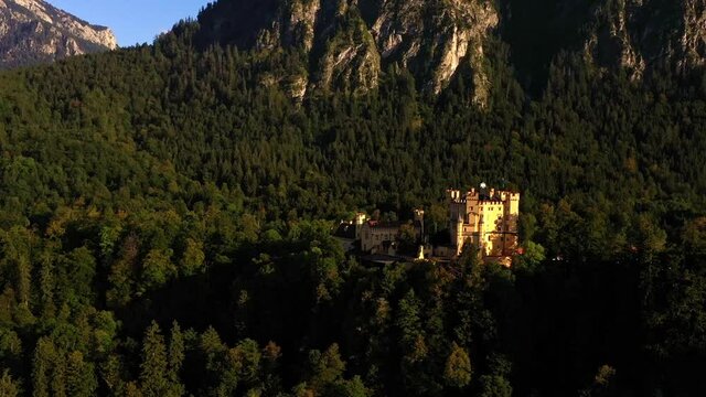 Cinematic dolly in aerial view of famous Hohenschwangau castle in Schwangau, Germany