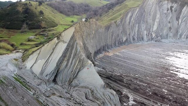 Aerial drone view of the coast flysch structure in the beach of Sakoneta in the Basque Country
