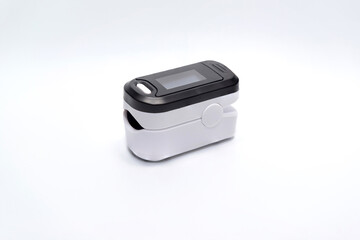 White portable fingertip pulse oximeter with multi-colored display isolated on white background. To measure SPO2 and Pr Values at home..