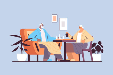 Fototapeta premium elderly couple playing chess senior man woman spending time together horizontal