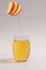 Apple Juice pouring into the glass.