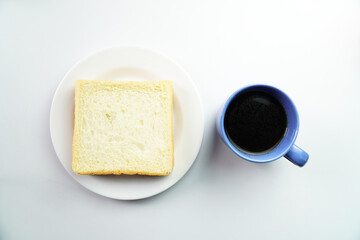 Top View of Breakfast Concept White Bread on plate with a cup of coffee on white background