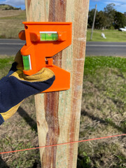 Different stages of replacing a old timber fence with a new pine timber fence