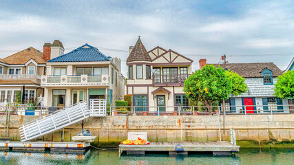 Pano Elegant houses overlooking public canal with walkways in Long Beach California