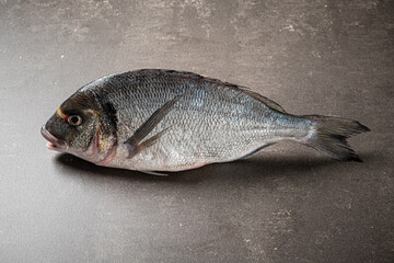 raw fish on the stone background
