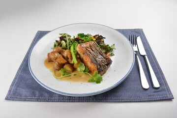 pan fried bbq fresh cod, salmon, grouper fish fillet in chef sauce with potato, corn and vegetables western halal menu