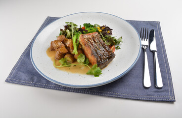 pan fried bbq fresh cod, salmon, grouper fish fillet in chef sauce with potato, corn and vegetables western halal menu