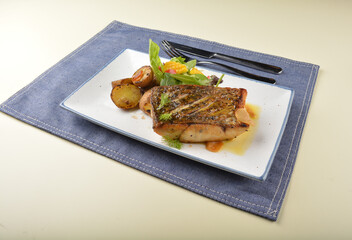 pan fried bbq fresh cod, salmon, grouper fish fillet in chef sauce with potato, corn and vegetables western halal menu