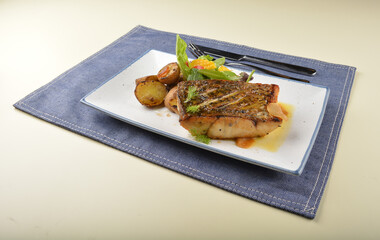 pan fried bbq fresh cod, salmon, grouper fish fillet in chef sauce with potato, corn and vegetables western halal menu