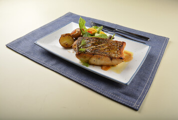 pan fried bbq fresh cod, salmon, grouper fish fillet in chef sauce with potato, corn and vegetables western halal menu