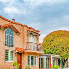 Square Road along homes with lovely facade and landscaping in Long Beach California