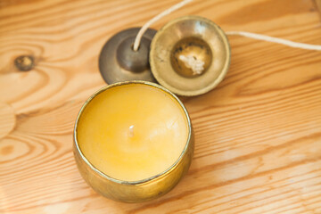 I put Tingsha on a wooden table.