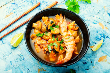 Tom yum soup with seafood and coconut milk