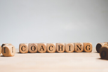 Coaching word cube on white background