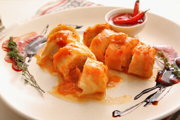Plate with tasty stuffed cabbage rolls, closeup