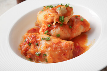 Plate with tasty stuffed cabbage rolls, closeup