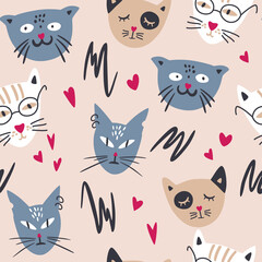 Obraz premium Seamless pattern with cute cats. Hand drawn difference cats faces background. Childish ornament. Perfect for printing on fabric, clothing, wrapping paper, wallpaper for a kid's room, baby things.
