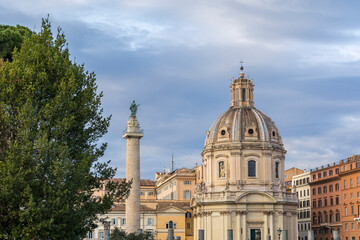 Obraz premium The Church of the Most Holy Name of Mary at the Trajan Forum (Santissimo Nome di Maria al Foro Traiano) and Trajan's Column in Rome, Italy