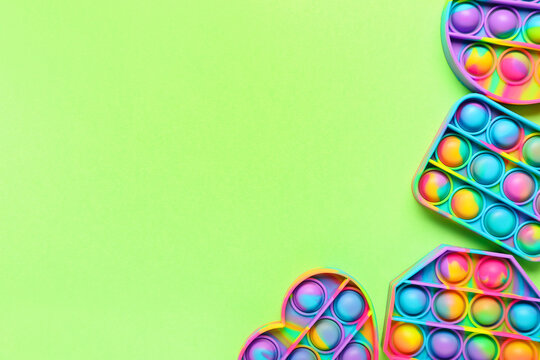 Pop it fidget toys on color background