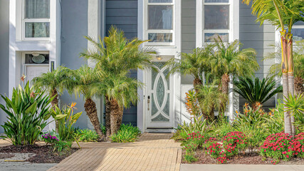 Fototapeta premium Pano Facade of modern townhomes in Huntington Beach California on a sunny day view