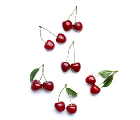 Tasty ripe cherries on white background