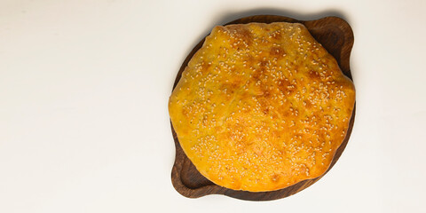 Traditional Georgian bread - khachapuri served over white. Homemade baking. Top view. Flat lay, overhead.