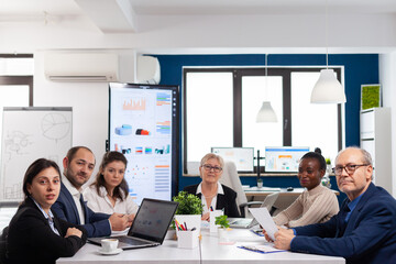 Pov of diverse team sitting in conference room during virtual meeting, discussing online with business partners. Internet conference call technology talk with investors, corporate brainstorming via