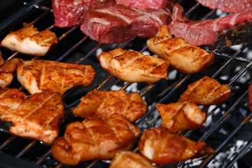 Various types of meat coking on family garden barbeque