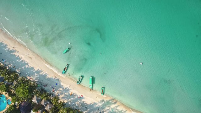 Aerial Shadow From Palm Trees On Beach By Sea. Premium Resort, Luxury Oceanfront Getaway. Boat Tours Tropical Islands And Sandbanks Lagoon Slow Motion. Tourism Cocos Island, Keeling, Australia