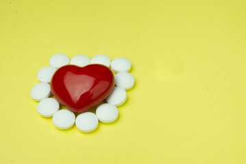 Medicine around red heart.Concept of health and medical.
