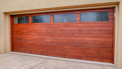 Obraz na płótnie Canvas Pano Wood door with glass panes of attached garage in San Diego California house