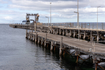 The wooden jetty along side the wharf in Kingscote Kangaroo Island South Australia on May 9th 2021