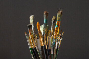 Dirty Paint brushes closeup on gray background
