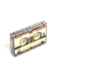 1980's magnetic audio micro cassette isolated on white background
