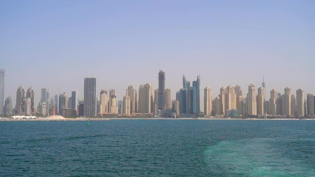 video from the yacht to Dubai marina and jbr. high-rise buildings along the sea