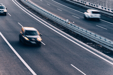 Fast moving blurry cars driving on the highway