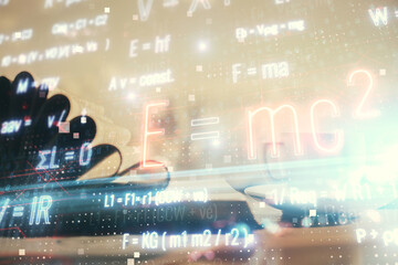 Double exposure of formula drawing and desktop with coffee and items on table background. Concept of education