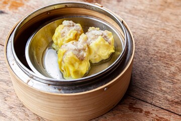 Chinese breakfast dumplings stuffed with crab in a wooden container