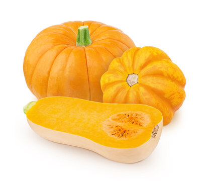 Vegetable composition with whole and halved pumpkins isolated on a white background.
