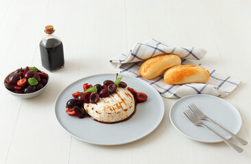Grilled Camemberts cheese, cherries with honey and balsamic vinegar syrup