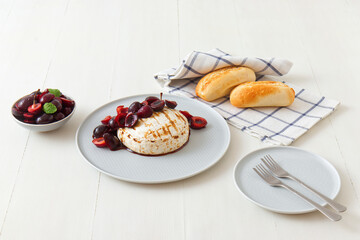 Grilled Camemberts cheese, cherries with honey and balsamic vinegar syrup